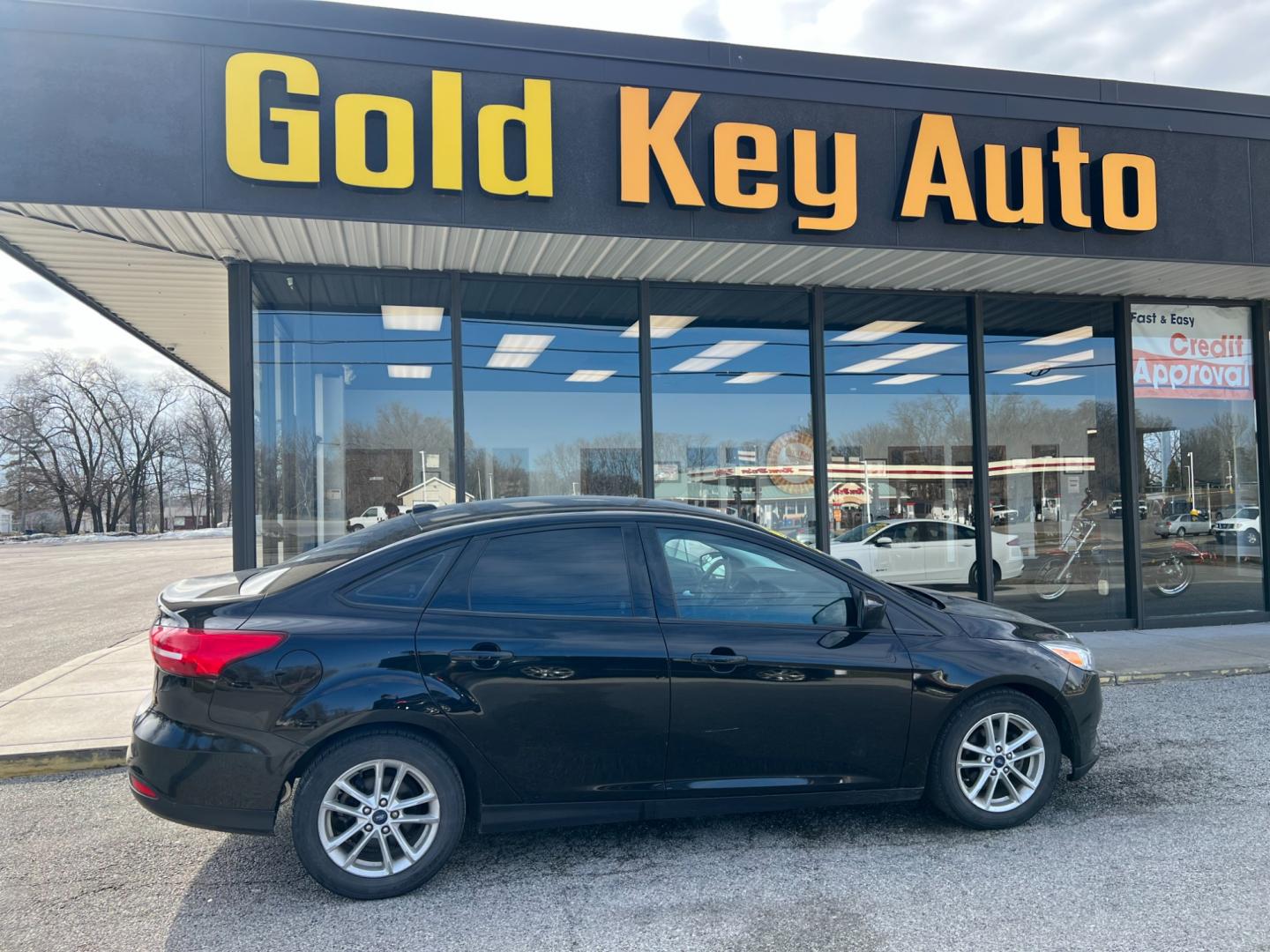 2018 Shadow Black Ford Focus SE Sedan (1FADP3FE7JL) with an 1.0L L3 engine, located at 1633 W Kimberly, Davenport, IA, 52806, (563) 323-5341, 41.559456, -90.598732 - Photo#0